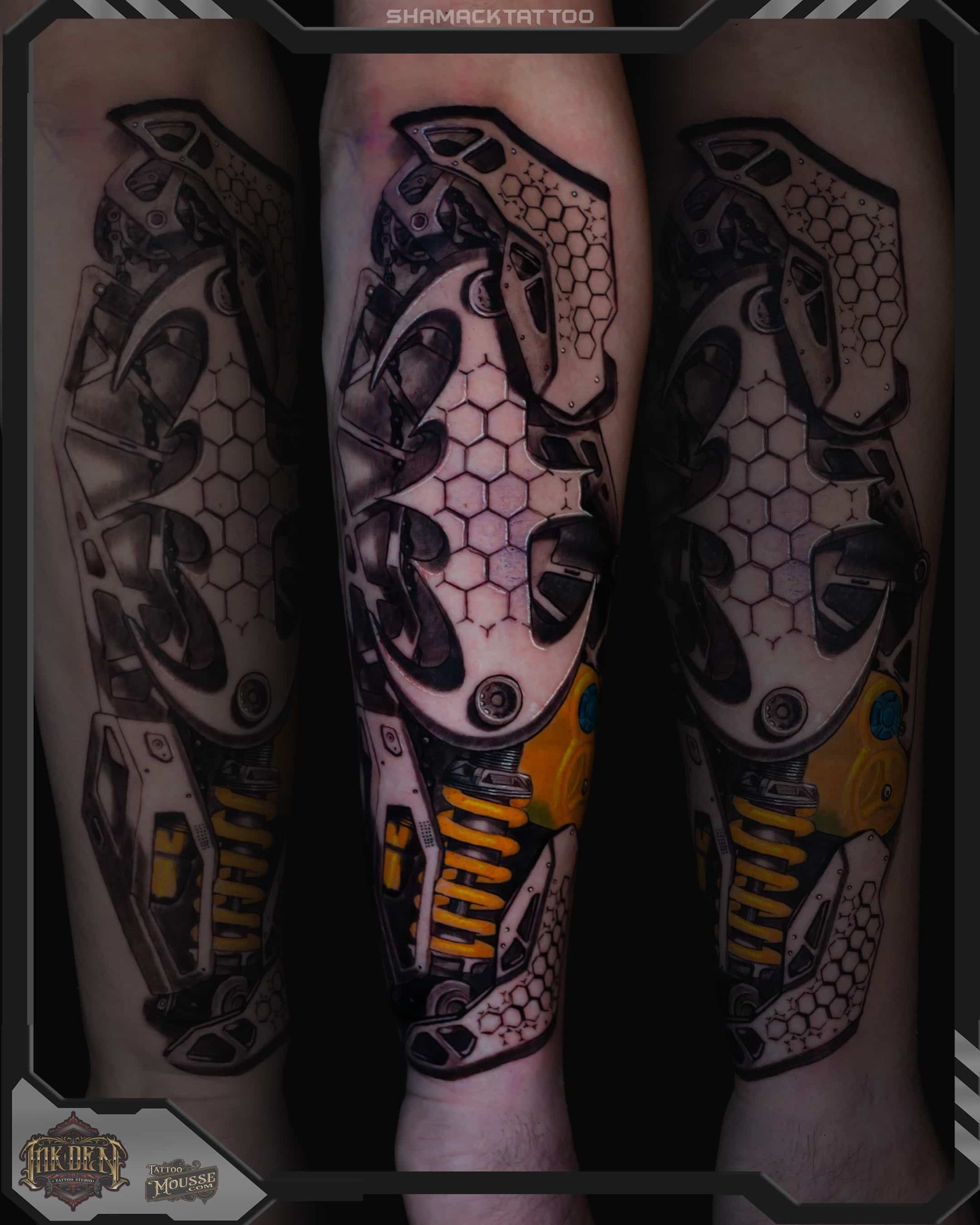 Close-up of a leg tattoo with a black-and-gray koi fish and honeycomb pattern, accented by yellow details