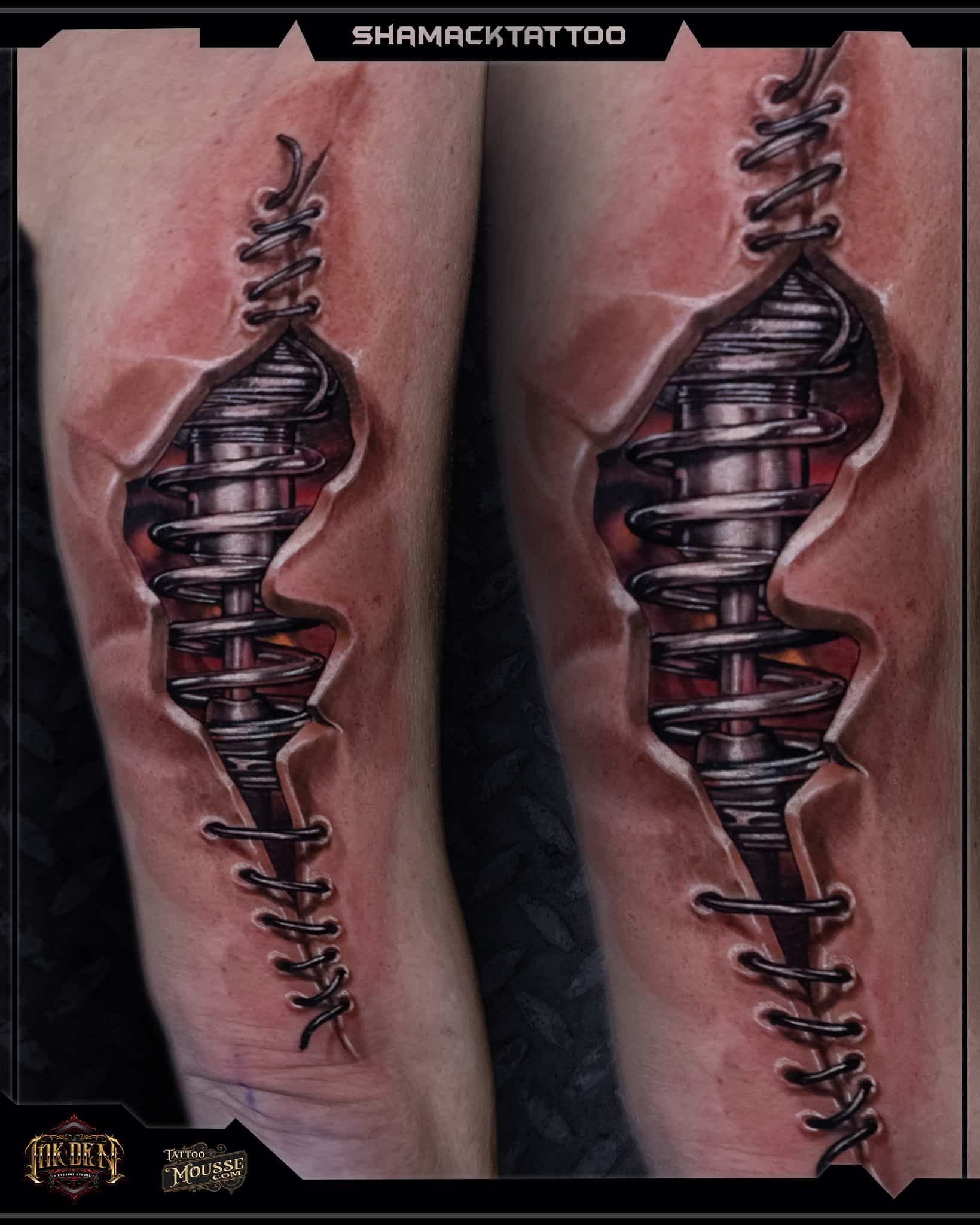 Two mirrored tattooed forearms with dark metallic spiral designs on pink skin background